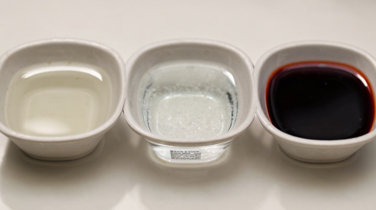 Three small bowls of liquid in a row showing pale thin, clear salty and dark intense stages
