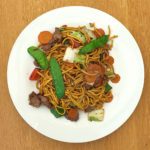 Recipe card for authentic Chicken Drunken Noodles served on a plate