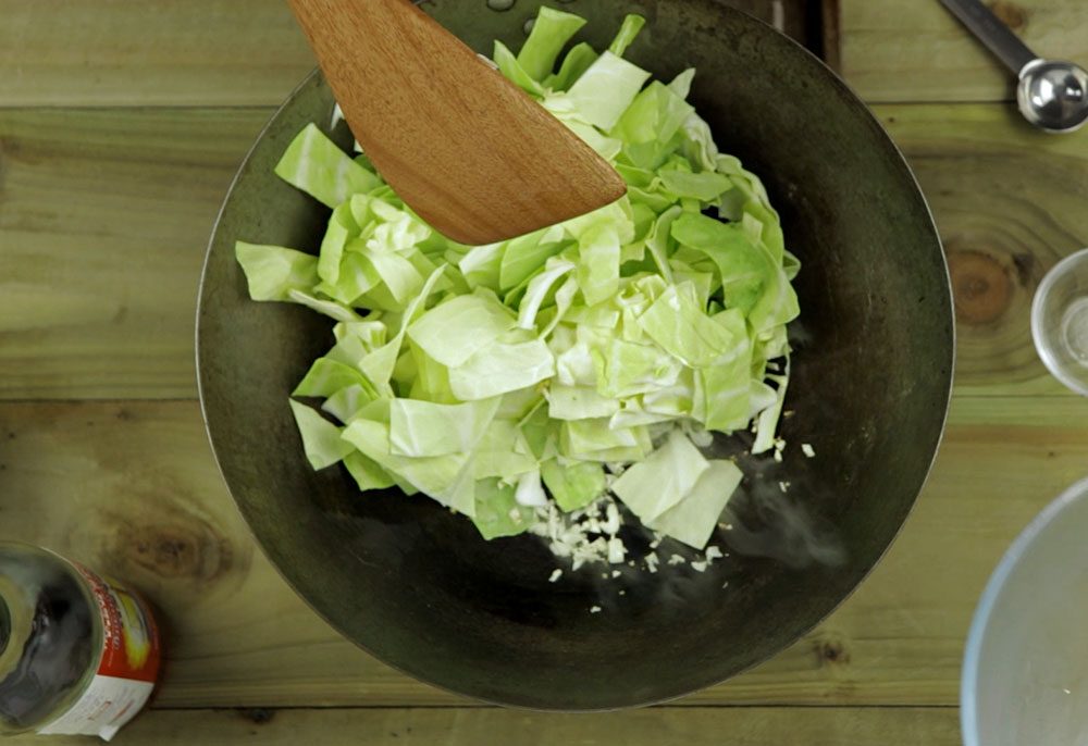 stir frying the garlic and cabbage
