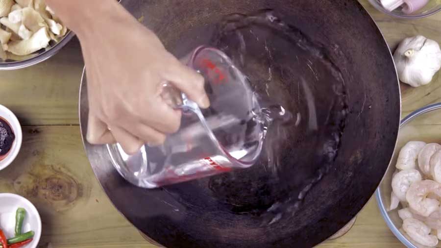 Add 2 cups of water to the wok