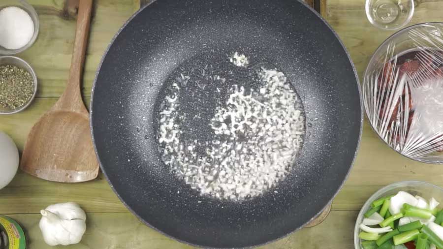 Stir-fry the garlic until it changes colour