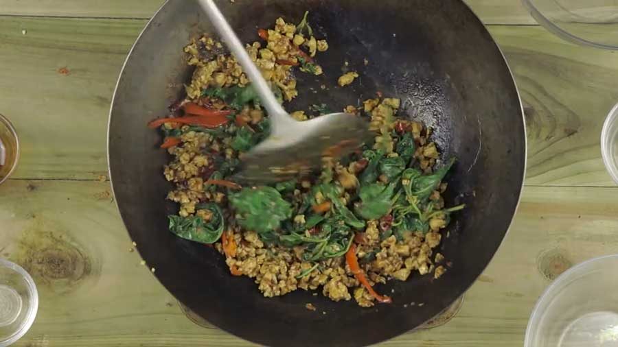 Stir-fry until the basil leaves are soft