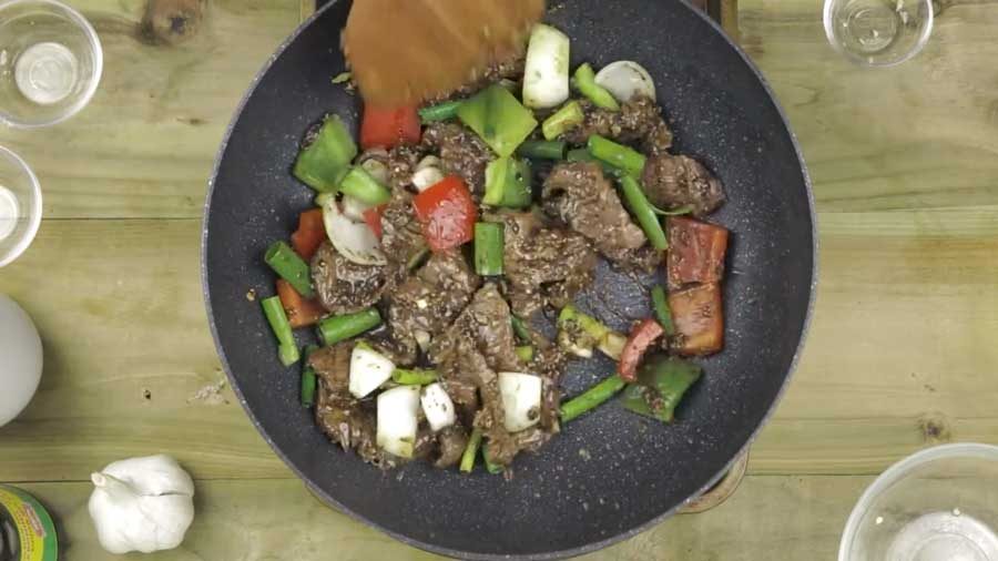 Stir-fry until the peppers begin to soften