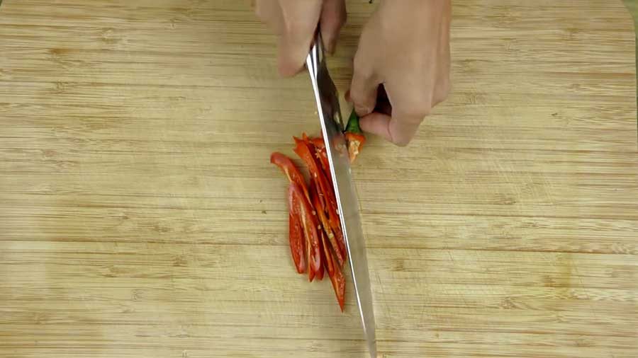 Thinly slice the red chilli