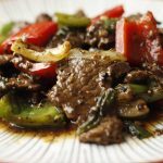 Nua pad prik thai dum recipe card with black pepper beef stir-fry