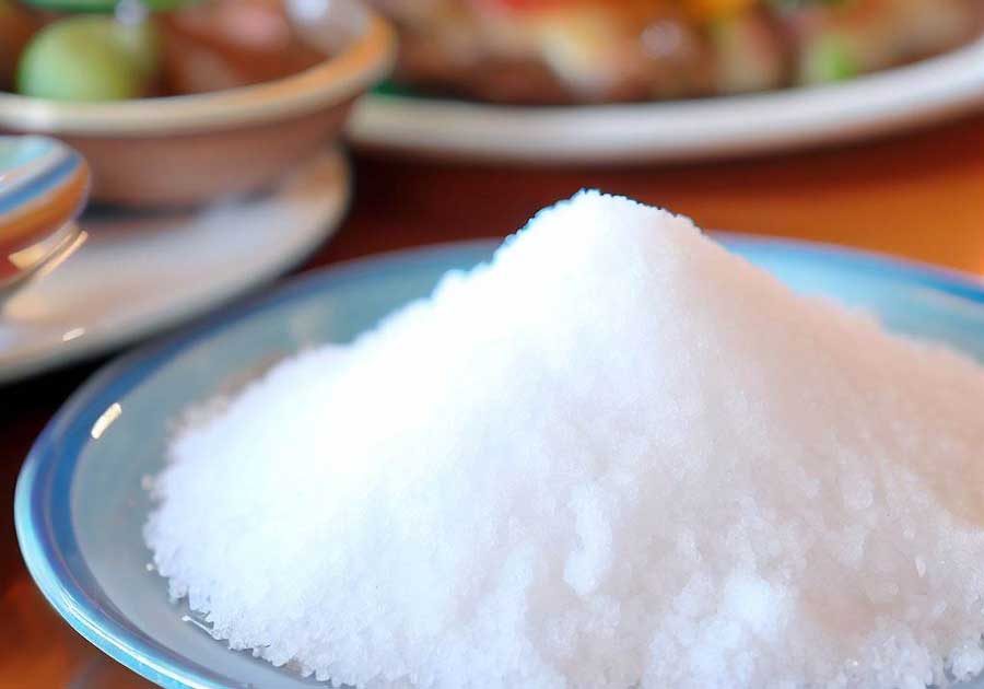 MSG condiment on a table at a Thai restaurant in Thailand