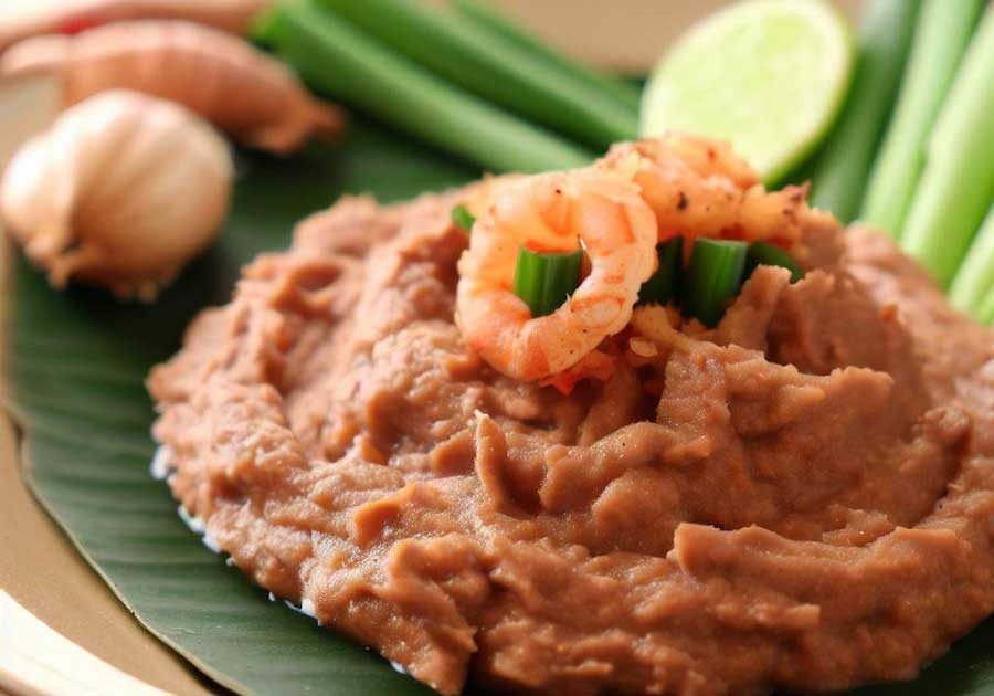 Fermented shrimp paste adding umami depth to Thai curry pastes