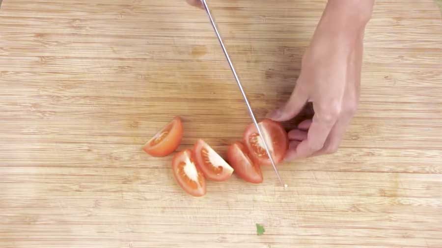 Slice the tomatoes