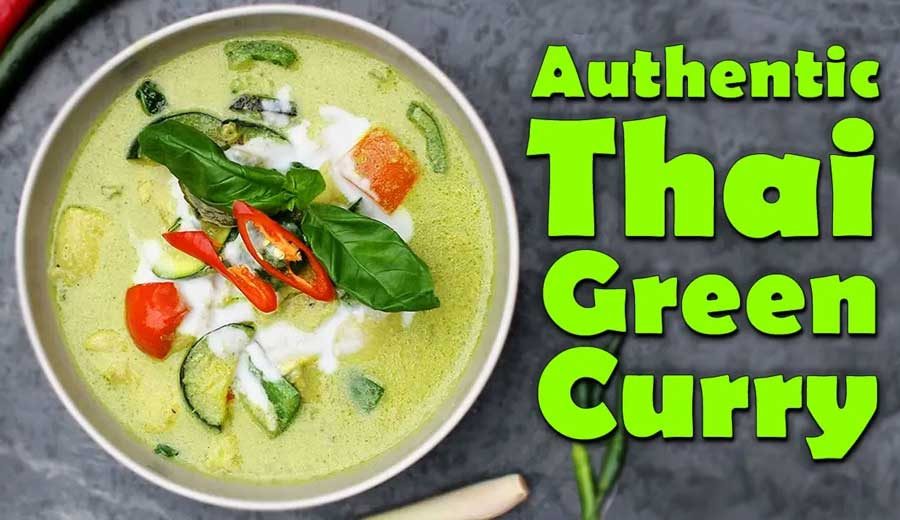 Authentic Thai green curry bowl with chicken bamboo shoots and fresh Thai basil leaves