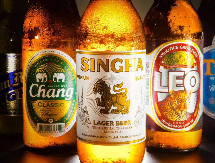 Three most popular Thai beer brands Singha Chang and Leo bottles on display together